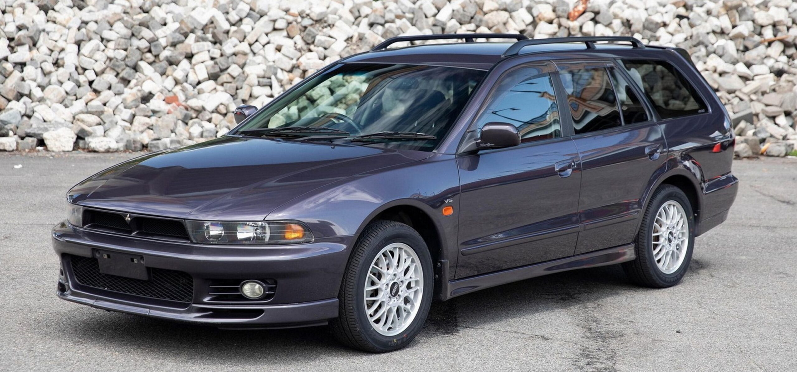 <p>The Mitsubishi Legnum is a station wagon variant of the Mitsubishi Galant, produced from 1996 to 2002. It's best known for its VR-4 model, which features a 2.5L V6 twin-turbocharged engine, all-wheel drive, and a sophisticated multi-link suspension. The Legnum VR-4 offers a blend of practicality and high performance, making it a favorite among car enthusiasts who appreciate versatile speedsters. Its engine and drivetrain make it highly tunable, allowing for significant horsepower increases with the right modifications. The Legnum VR-4 is popular in the aftermarket community for custom builds and performance upgrades. </p>:: Mitsubishi