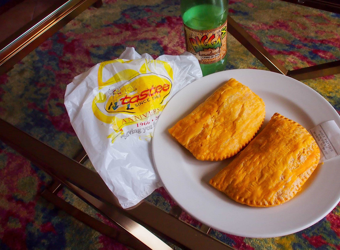<p> Jamaican patties are a favorite snack or meal on the go. These flaky pastry pockets are filled with various ingredients, including spiced beef, chicken, or vegetables. The dough is usually tinted yellow, giving the patties their distinctive color. Spicy, savory, and satisfying, Jamaican patties are a must-try, whether you grab one from a street vendor or a local bakery. If possible, seek out freshly basked patties from Tastee.. </p> :: Uncommon Caribbean