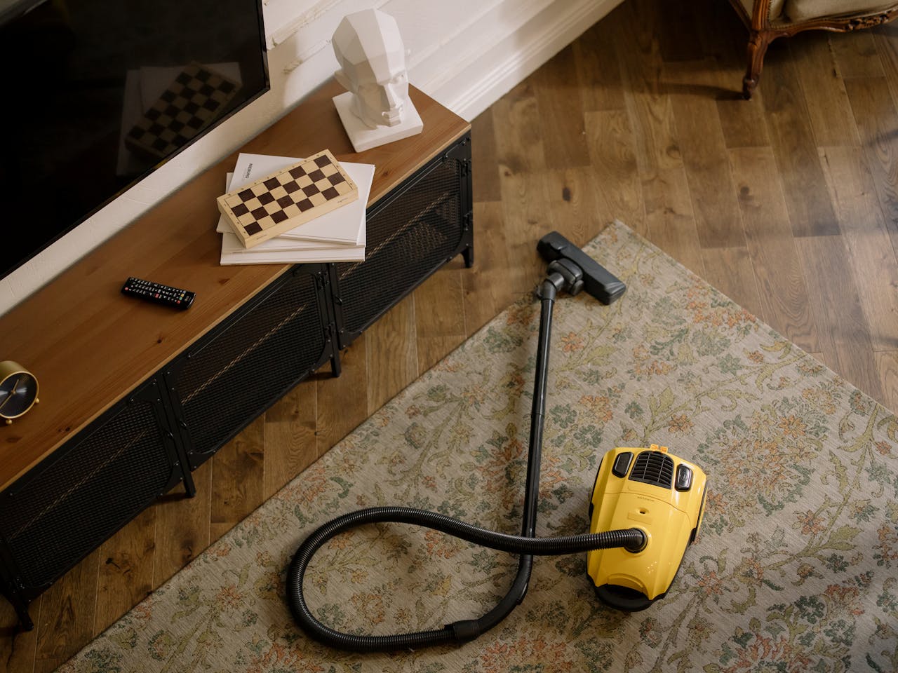 <p> Did you know that vacuuming in the same direction can flatten carpet fibers, making it harder to pick up dirt and debris? For a deeper clean, try changing your vacuuming direction! Quick Tip: Alternate between vertical and horizontal passes to lift and fluff those fibers while effectively removing dirt. Your carpets will not only look better, but they'll also feel fresher underfoot, inviting you to kick off your shoes and enjoy your space! Plus, a little extra care goes a long way in extending the life of your carpets. </p> :: Pexels