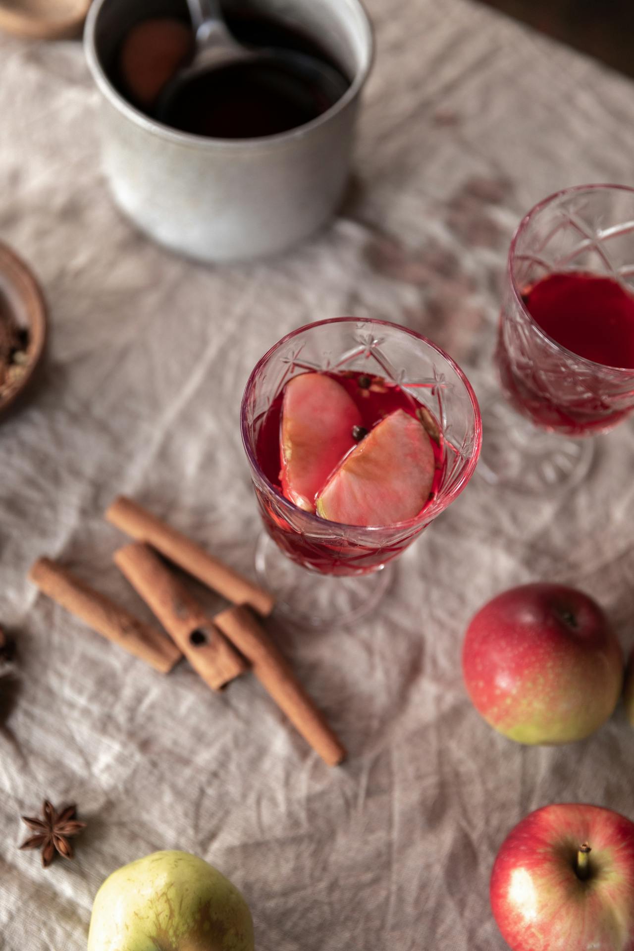 <ol> <li> In a saucepan, heat the apple cider with the cinnamon stick and star anise over medium heat until warm (do not boil). </li> <li> Remove from heat and stir in lemon juice. </li> <li> Pour the warm cider into mugs and garnish with apple slices. </li> <ol> :: Pexels