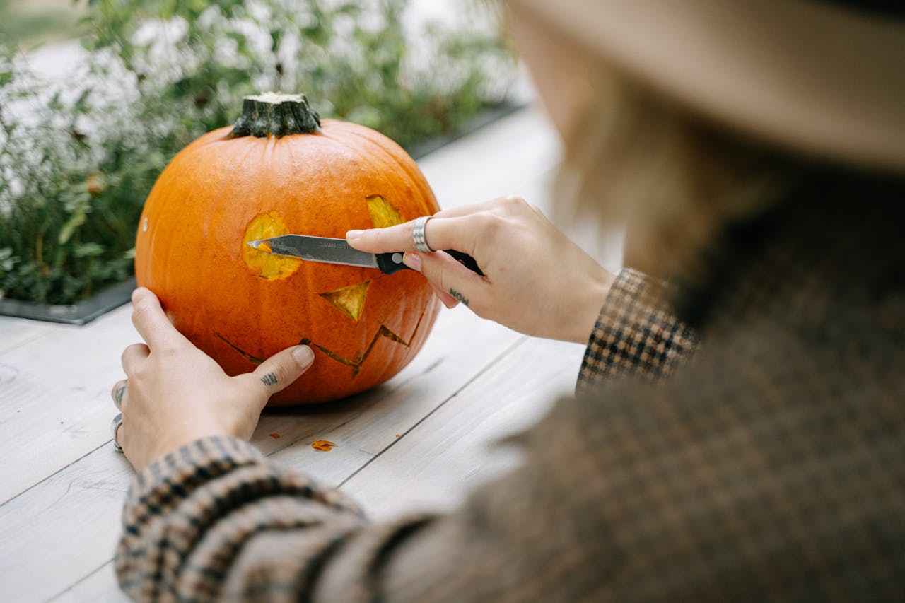 <p> Pumpkin carving is a classic Halloween activity that can easily be adapted for a virtual gathering. Encourage your guests to carve or decorate their pumpkins ahead of time, showcasing their creativity. Set a time during your party for everyone to present their pumpkins, and allow guests to vote for their favorites in various categories, such as “most creative,” “scariest,” or “funniest.” To make it even more exciting, consider hosting a live carving session where guests can carve their pumpkins together while sharing tips and tricks. This collaborative experience fosters connection and allows everyone to showcase their artistic skills. </p> :: Pexels