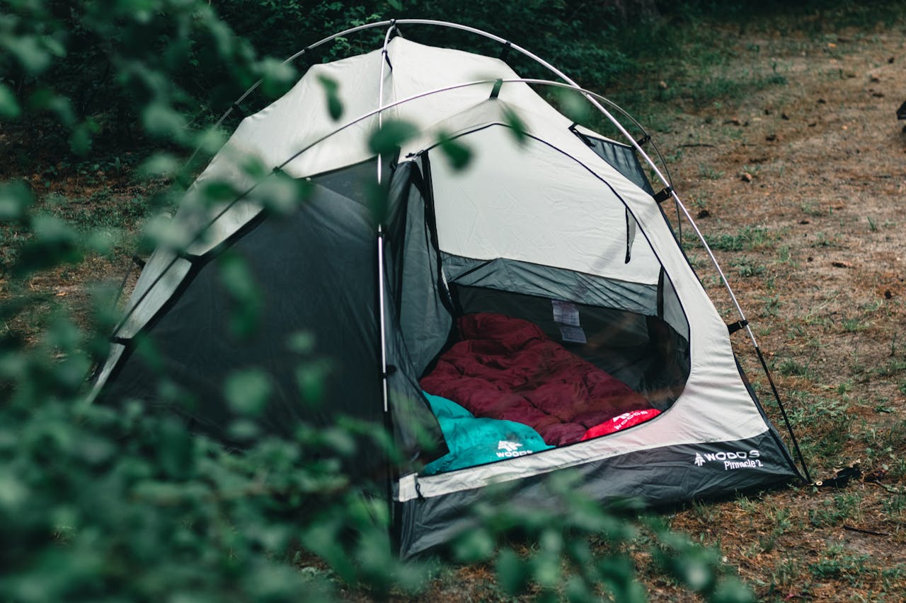 <p> When it comes to camping, comfort is key, especially when it comes to where you'll sleep. A reliable tent is a must-have to keep you safe from the elements, insects, and critters. Look for a tent that is easy to set up and provides adequate protection against rain and wind. In addition to the tent, pack a high-quality sleeping bag suited to the weather conditions and a sleeping pad for extra comfort. Many people overlook how much warmth and cushion a sleeping pad provides, and trust me, your back will thank you after a long day of hiking or exploring. </p> :: Pexels