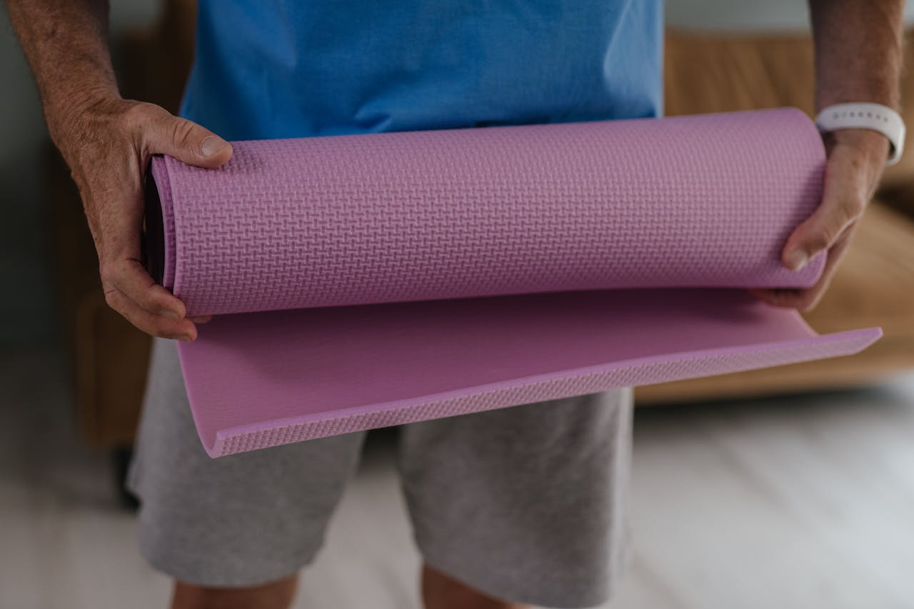 <p> A travel yoga mat is a must-have for those who love yoga, stretching, or meditation while on the go. These mats are designed to be foldable or rollable, making them compact and easy to pack in your suitcase. Although thinner than regular mats, they still provide the necessary cushioning for a comfortable practice. Whether you're doing yoga in your hotel room or enjoying a morning stretch at the airport, a travel yoga mat gives you the space you need to unwind and stay centered. With their affordable price and portability, these mats are a great addition to your travel fitness routine. </p> :: Pexels