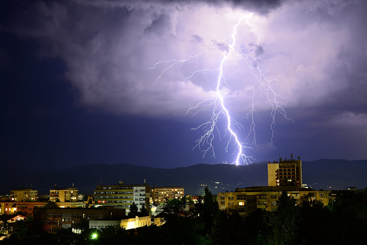 <p> Debunked: The idea that lightning never strikes the same spot twice is one of the most persistent weather myths. While it might seem plausible—especially given how unpredictable lightning can be—the reality is quite the opposite. Tall structures, like skyscrapers and trees, are often struck multiple times by lightning during a single storm. The Empire State Building in New York City, for example, is hit by lightning around 20-25 times each year! This happens because lightning naturally seeks out the tallest object in its path, regardless of whether it has struck there before. Takeaway: Avoid standing near tall objects or in open fields during a thunderstorm, as these are prime targets for lightning—whether they’ve been struck before or not. </p> :: Pexels