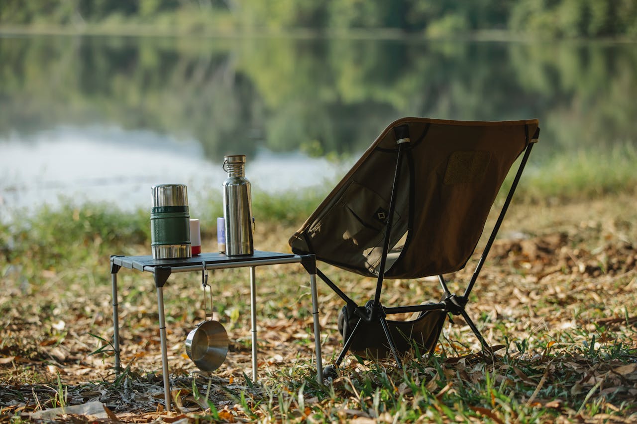 <p> Sitting on the ground might sound like part of the camping experience, but bringing along a foldable camping chair and table can make meal times and relaxation far more comfortable. These items are lightweight and can easily fit in the back of your car or attached to your backpack. Whether you're enjoying a meal, reading a book, or simply watching the sunset, having a comfortable chair to sit on will be a game-changer. Plus, a table makes meal prep and dining much easier, keeping your food and equipment off the ground. </p> :: Pexels