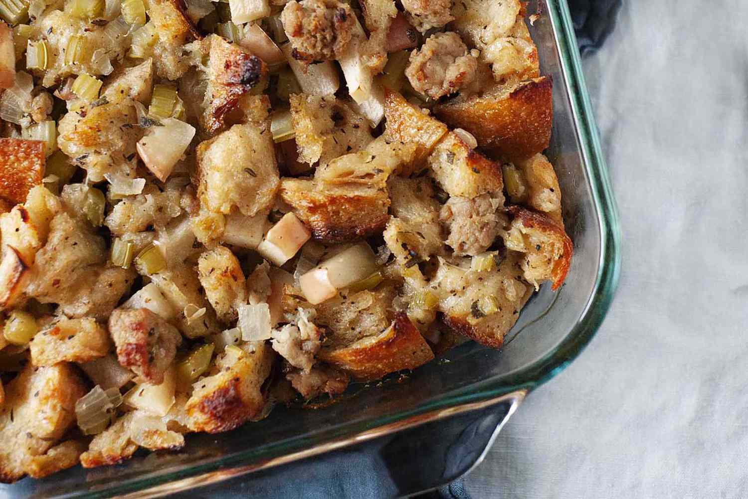 <p> Stuffing is an essential part of Thanksgiving, and this version elevates the classic dish. Combining savory sausage, diced apples, celery, and onions with chunks of crusty bread, this recipe is flavored with aromatic herbs and baked to perfection. It captures the essence of fall and is a guaranteed crowd-pleaser. </p> :: Alison Bickel / simplyrecipes.com