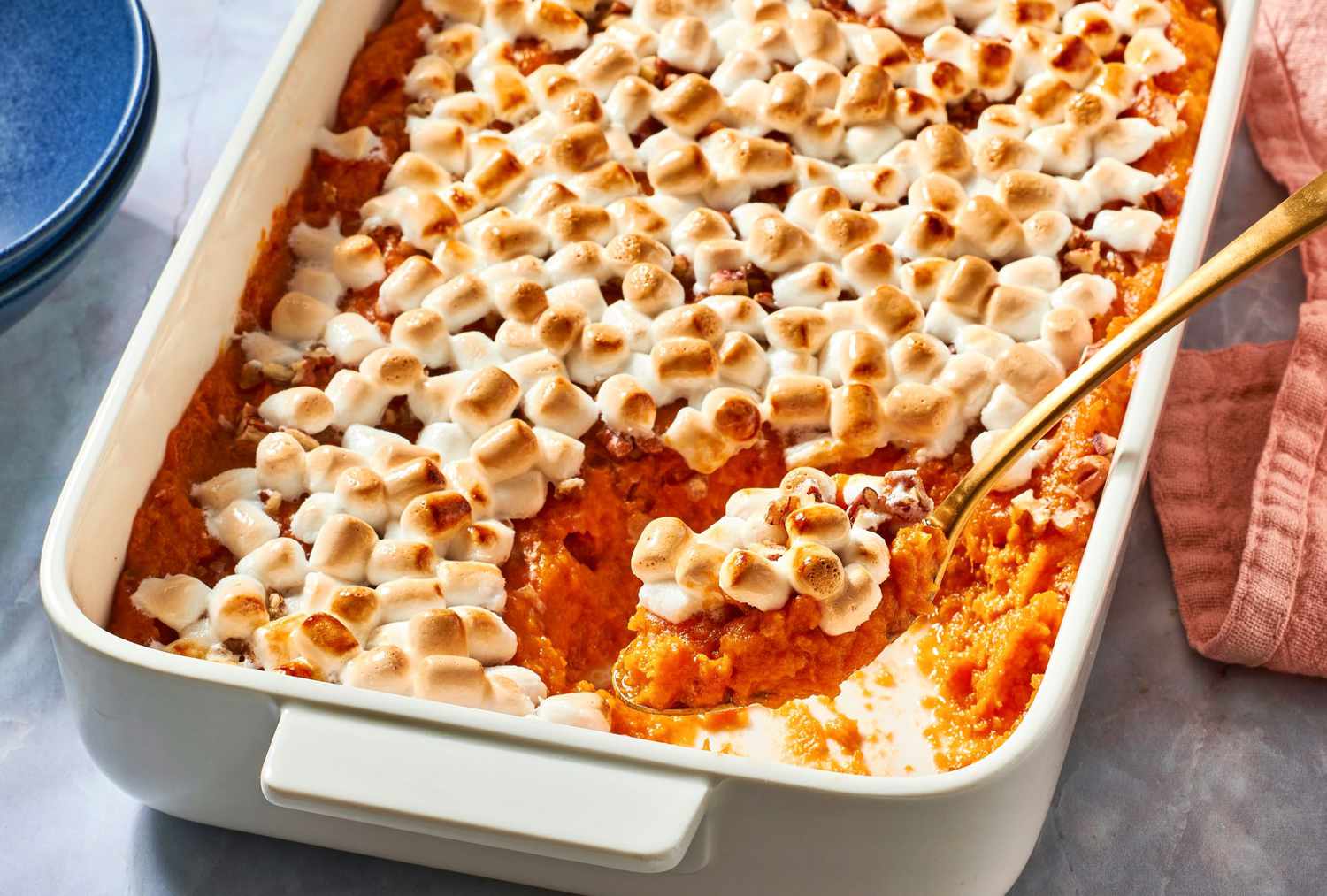 <p> Sweet potato casserole is a dish that feels like dessert but belongs right on the main table. Creamy mashed sweet potatoes are mixed with brown sugar, cinnamon, and nutmeg, then topped with a layer of gooey marshmallows. The result is a nostalgic and irresistible addition to your Thanksgiving menu. </p> :: Diana Chistruga / eatingwell.com