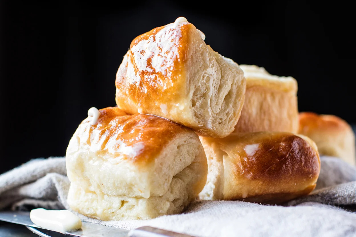 <p> These homemade Parker House rolls are soft, fluffy, and loaded with buttery goodness. Baked to golden perfection, they are perfect for mopping up gravy or turning leftover turkey into mini sandwiches. The smell of these fresh-from-the-oven rolls is enough to make mouths water. </p> :: kingarthurbaking.com