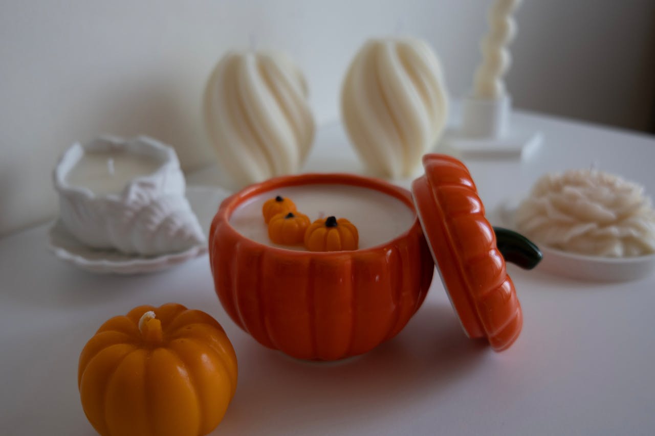 <p> The comforting scent of pumpkin spice instantly brings the fall season to life. Making your own candles at home is easier than it sounds and a great way to enjoy the autumn aroma. You will need soy wax flakes, pumpkin spice-scented oil, candle wicks, and glass jars. Start by melting the wax in a double boiler, then mix in the scented oil. Carefully pour the mixture into your jars, placing a wick in each one. Let the candles cool and solidify before lighting them up. These homemade candles are perfect for setting a cozy mood and filling your space with the warm, inviting scent of fall. </p> :: Pexels