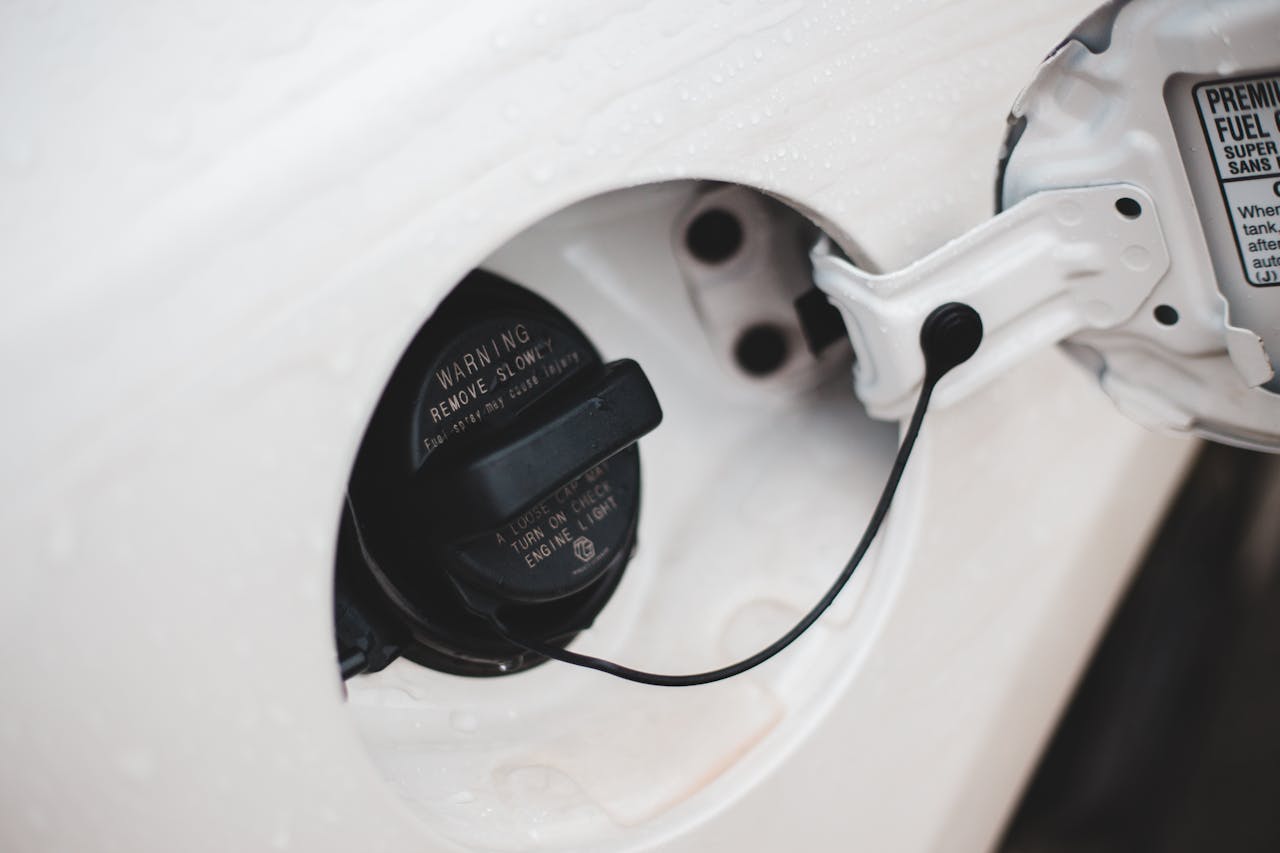 <p> Fumbling with the gas cap while refueling is unnecessary when most cars provide a designated spot for it. Look for a small hook or holder on the fuel door or inside the lid. This feature keeps the cap secure, preventing it from dangling or scratching your car’s paint. It may seem like a small detail, but it can make filling up more convenient and ensure you don’t lose or misplace your fuel cap—saving you potential headaches down the line. </p> :: Pexels