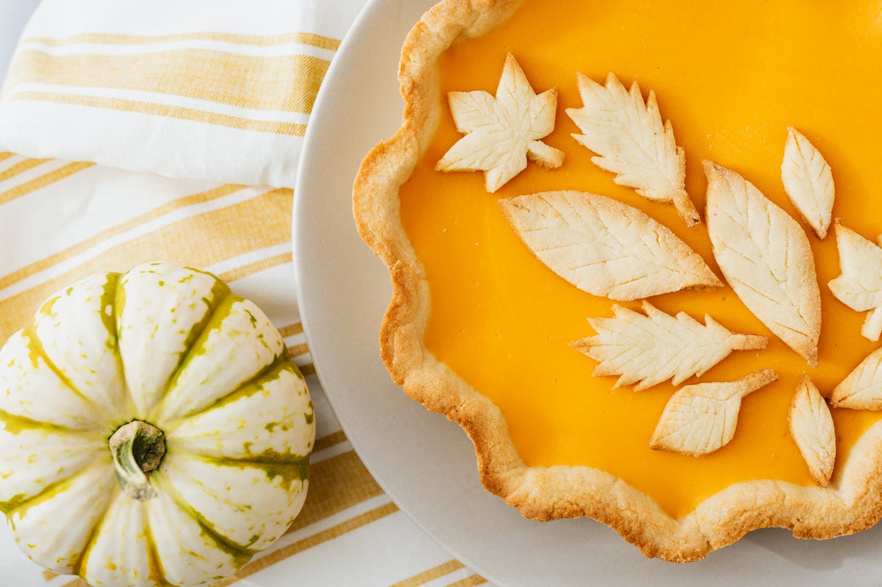 <p> Pumpkin pie is a Thanksgiving tradition, but this version adds an exciting twist. With a gingersnap crust and a touch of maple syrup in the filling, this creamy, spiced dessert is the perfect way to wrap up your feast. Topped with whipped cream, it is a slice of holiday heaven. </p> :: Pexels