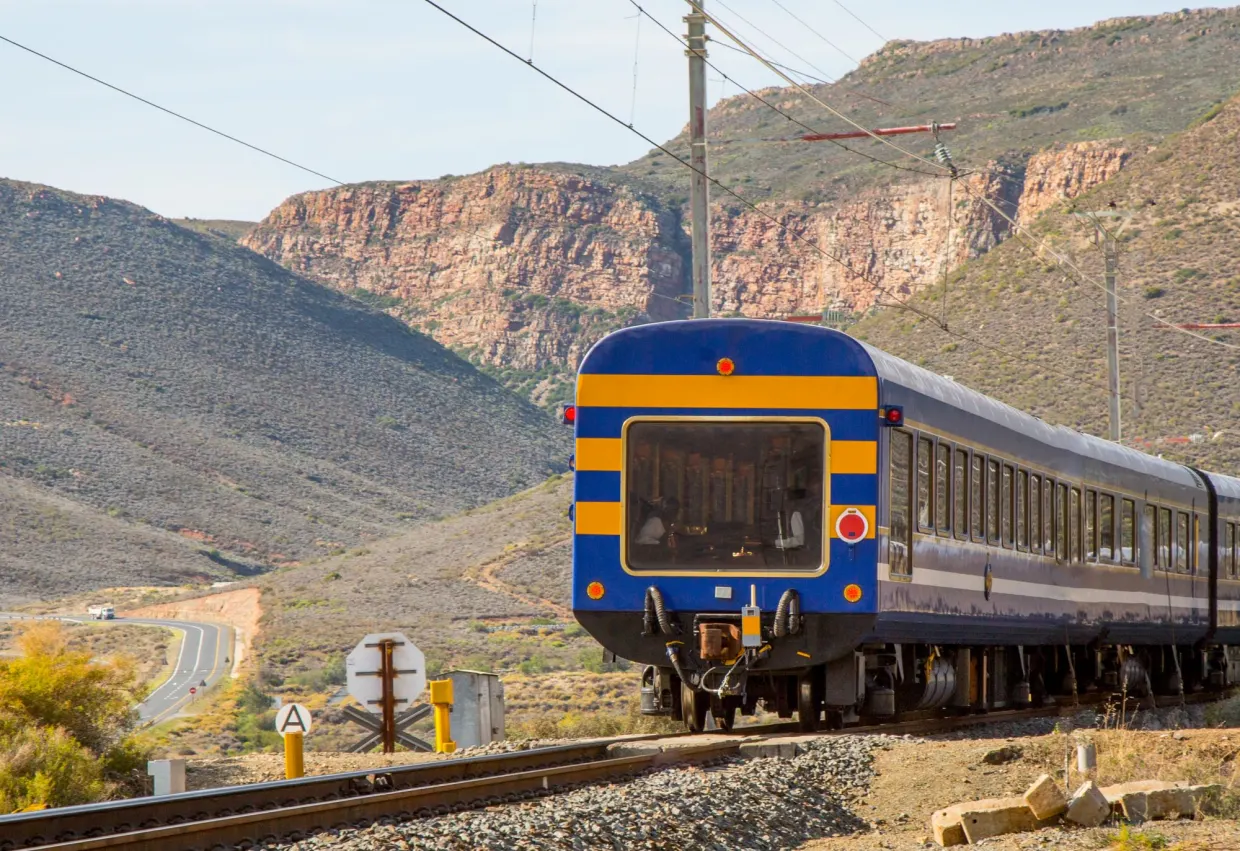 <p> Step into the lap of luxury with a ride on South Africa’s Blue Train, often described as a moving five-star hotel. This journey between Pretoria and Cape Town showcases nearly 1,000 miles of extraordinary scenery, including vineyards, deserts, and mountain ranges. The onboard experience includes gourmet dining, butler service, and plush suites, ensuring that your comfort is as memorable as the landscapes outside. </p> :: Craig Platt | The Sydney Morning Herald