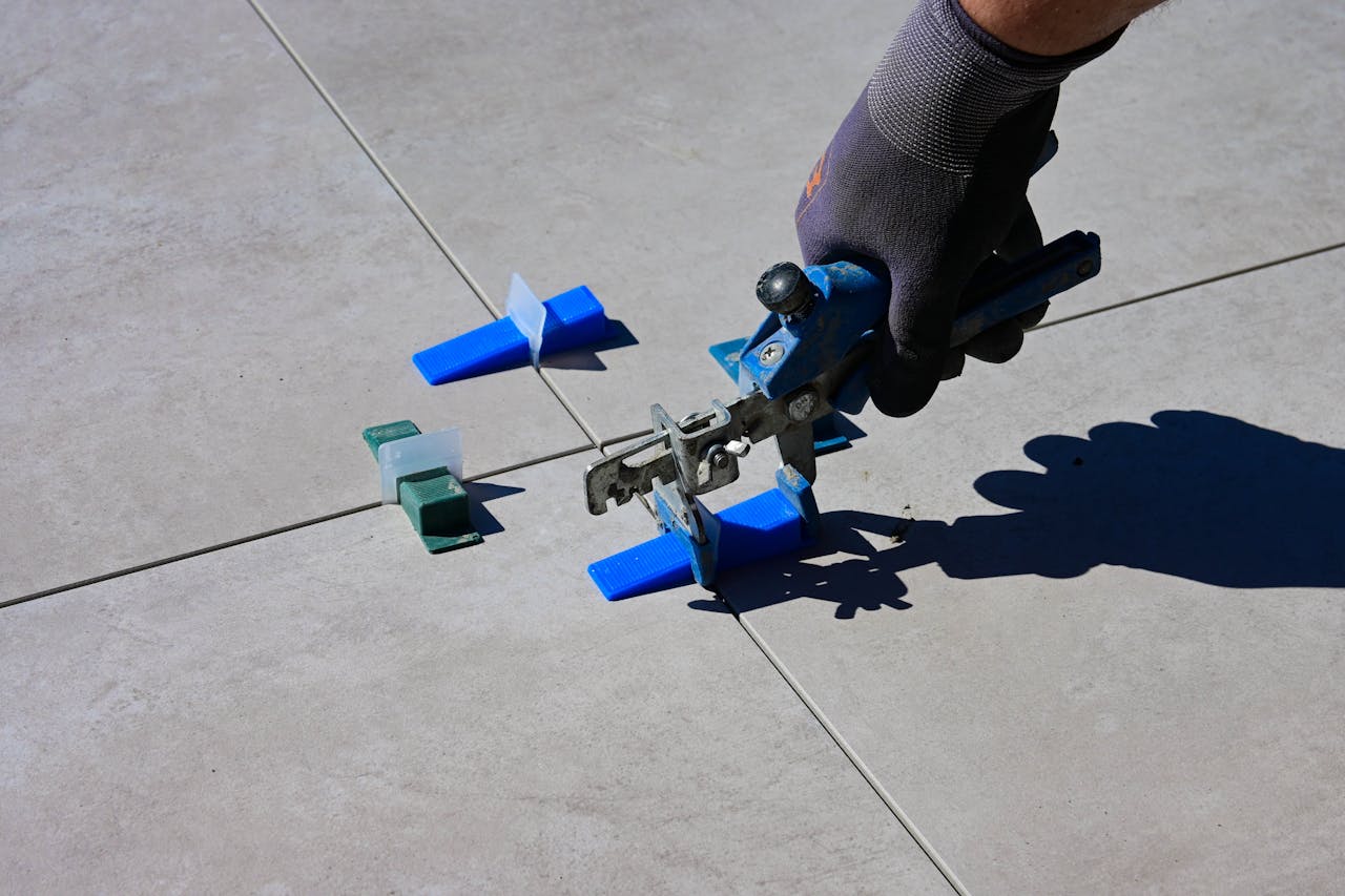 <p> Over time, the grout between tiles can become discolored or damaged, making your floors look worn and outdated. Re-grouting your tile floors is a relatively simple DIY task that can restore the beauty of your bathroom or kitchen floors. With a grout removal tool, new grout, and some elbow grease, you can tackle this project yourself. It’s a cost-effective way to refresh your floors and extend the life of your tile without having to pay for professional re-grouting services. </p> :: Pexels