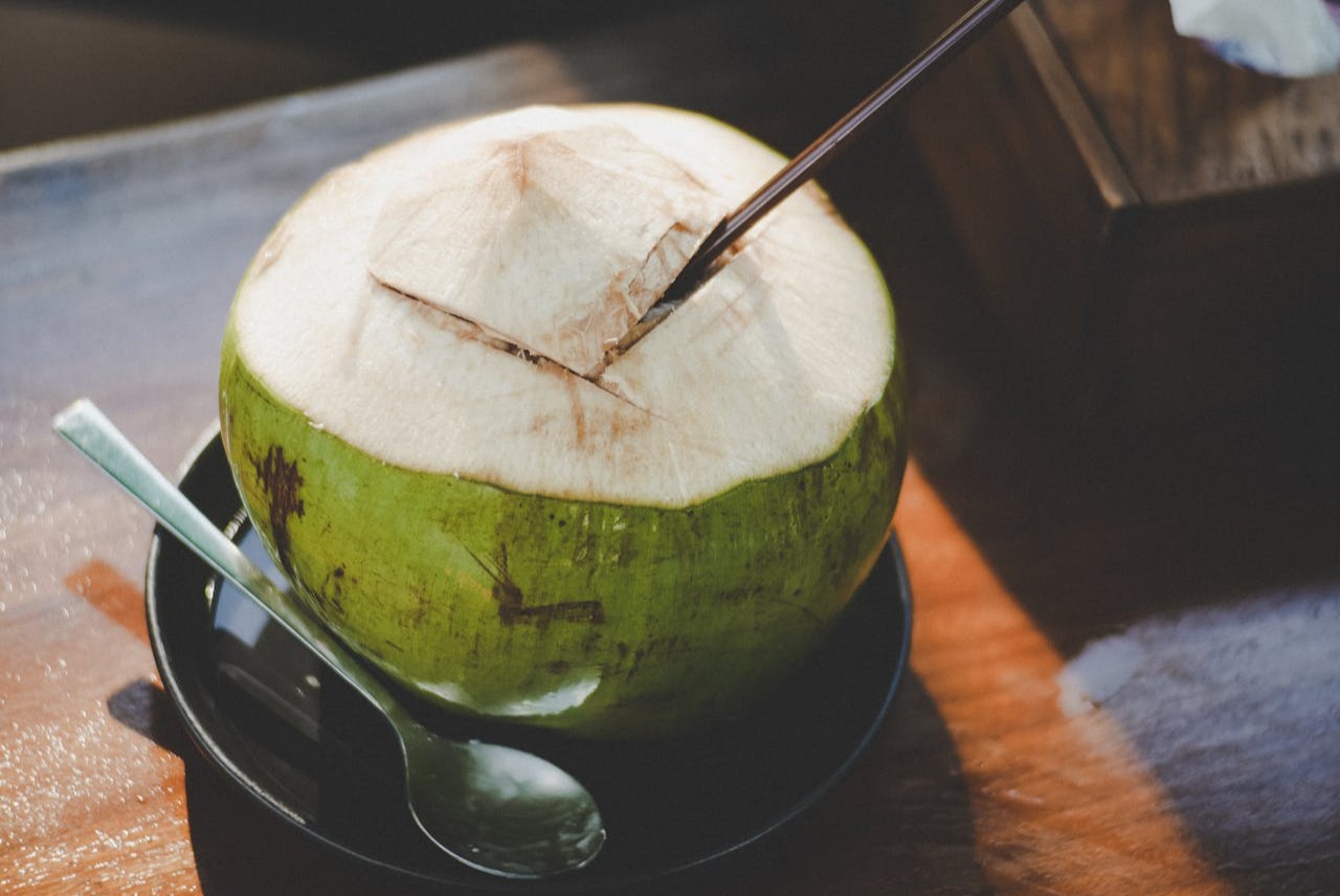 <p> Coconut water is a natural electrolyte drink that is perfect for rehydrating after a workout. It contains potassium, magnesium, and sodium, all of which help prevent muscle cramps caused by dehydration. Unlike commercial sports drinks, coconut water is low in calories and free of artificial additives, making it a healthier choice. Sip on coconut water to replenish lost fluids and keep your muscles cramp-free. </p> :: Pexels