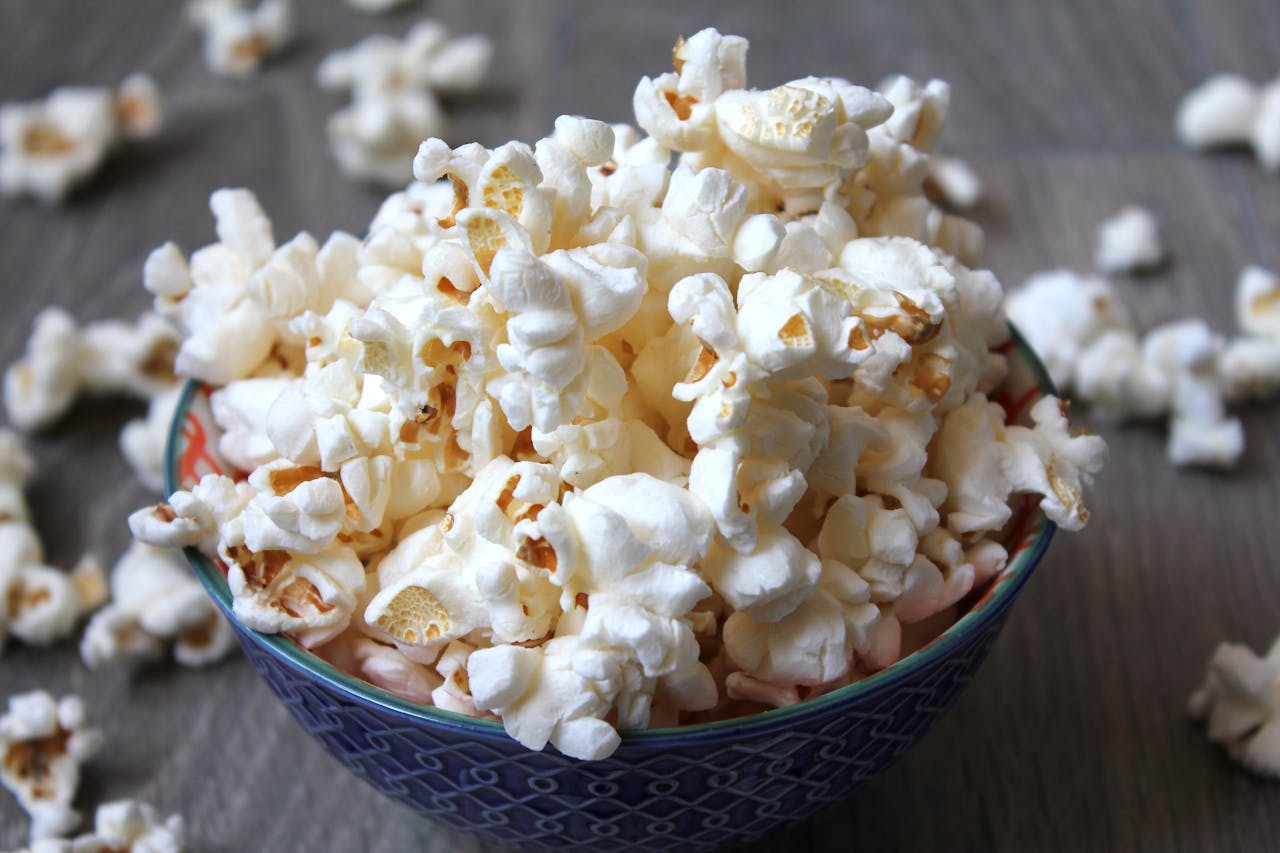 <p> Popcorn is a whole grain that is low in calories and high in fiber, making it a great snack option. When air-popped and lightly seasoned, it is a healthy alternative to chips or other fried snacks. Avoid pre-packaged varieties with excessive butter and salt, and try seasoning it with herbs or nutritional yeast for added flavor. Popcorn is also a budget-friendly snack that can be prepared in large batches for convenience. Its versatility allows you to experiment with sweet or savory toppings, making it a crowd-pleaser for all ages. </p> :: Pexels