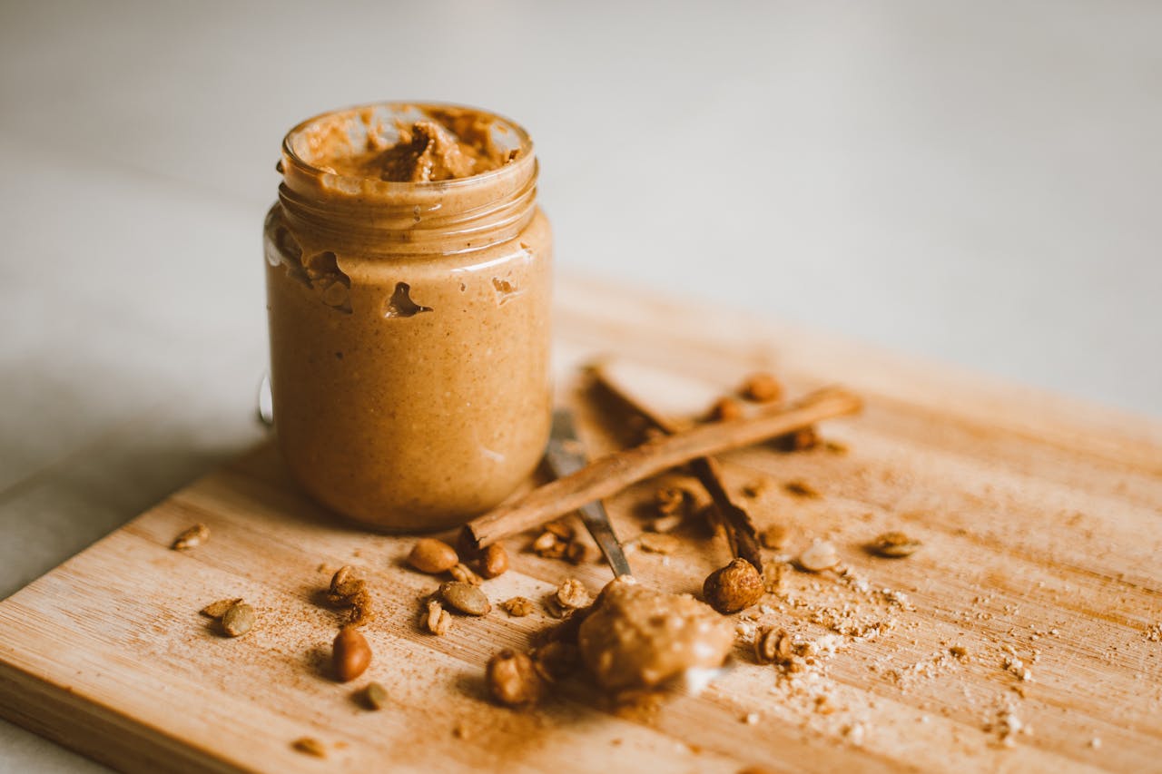 <p> Natural peanut butter, almond butter, and other nut spreads are minimally processed and packed with healthy fats, protein, and fiber. Look for options with just nuts and a pinch of salt on the ingredient list to avoid added sugars and hydrogenated oils. Spread it on whole-grain toast or add it to smoothies for a nutritious boost. Nut butters are also an excellent source of energy, making them a great pre-workout snack. Incorporate them into baking recipes or drizzle them over oatmeal for added flavor and nutrition. </p> :: Pexels