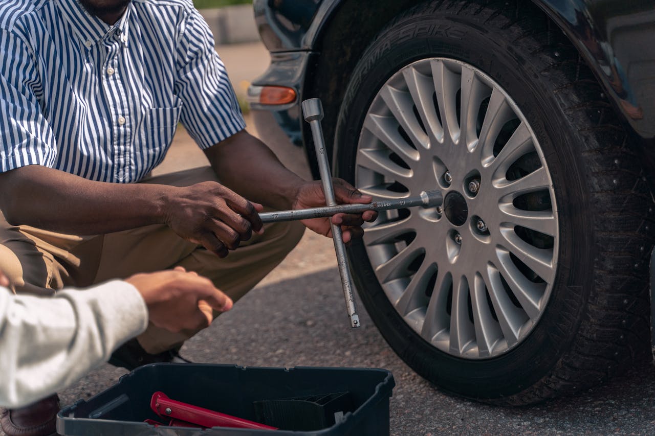 <p> No car tool kit is complete without a spare tire and a jack. When a tire goes flat and a repair kit isn’t enough, you’ll need to replace the tire entirely. The spare tire is usually stored in the trunk or under the vehicle, and the jack allows you to lift the car safely to swap the damaged tire for the spare. Make sure your spare tire is in good condition and properly inflated, and that your jack is easy to use and sturdy enough for your car’s weight. It’s also important to ensure that you have a lug wrench to remove the bolts from the flat tire. If you’re not sure how to change a tire, it’s worth taking the time to learn, as it’s a valuable skill that can save you in an emergency. </p> :: Pexels