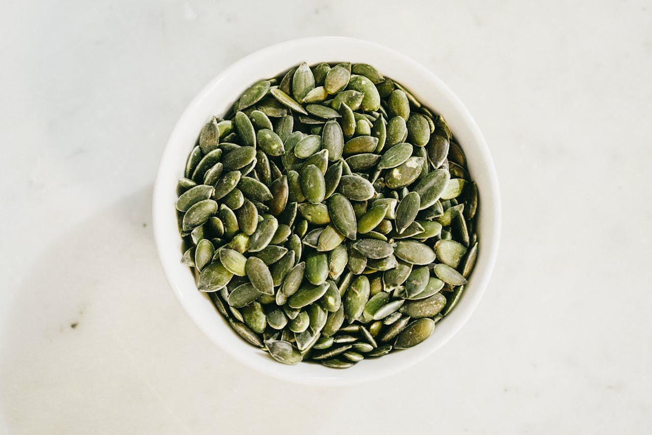 <p> Pumpkin seeds are a nutrient-dense snack that supports muscle health. They are packed with magnesium, zinc, and healthy fats, all of which contribute to muscle relaxation and recovery. Magnesium, in particular, plays a crucial role in preventing cramps by helping muscles contract and relax properly. Sprinkle pumpkin seeds on your yogurt, oatmeal, or salads for a crunchy and nutritious boost. </p> :: Pexels