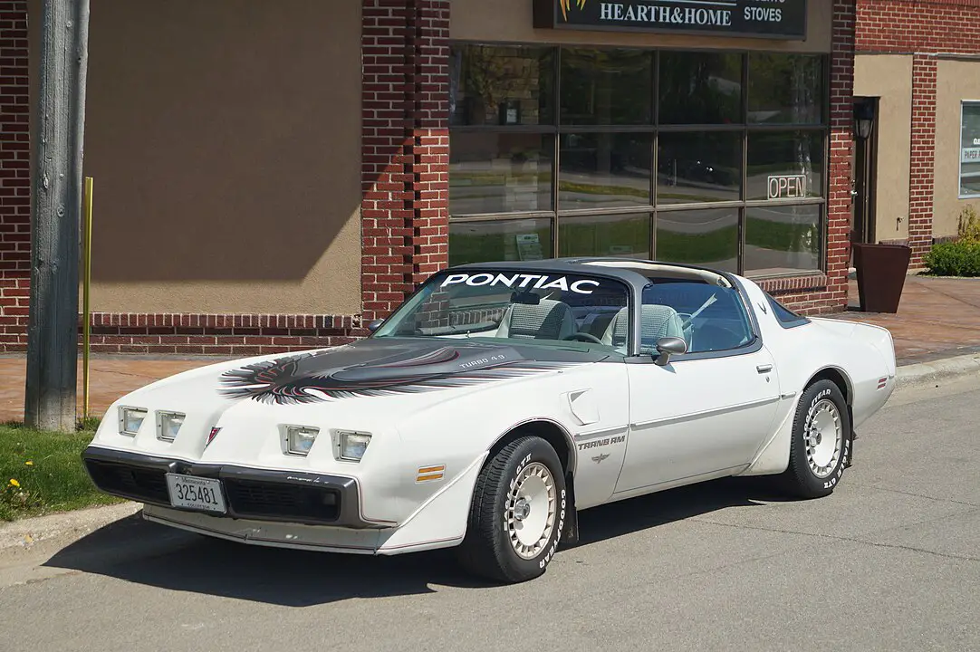 <p>The Trans Am gained massive popularity thanks to its appearance in the TV show “Knight Rider,” where it starred as KITT, a super-intelligent, talking car. It was also known for its distinctive “screaming chicken” hood decal. The car’s T-top roof design allowed for an open-air driving experience.</p> ::GregGjerdingen