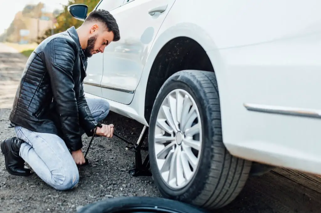 <p> Scammers often target drivers with flat tires, especially if they notice you’re struggling to change it. They may offer to help, but their true goal is to distract you while they steal items from your car or cause additional damage. If you’re in need of assistance, it’s safer to call a trusted roadside service rather than accepting help from a stranger. Always keep your valuables hidden and locked in your car, and if you’re not comfortable with someone offering help, don’t hesitate to decline. </p> :: Freepik