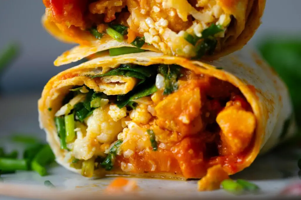 <p> A breakfast burrito is a portable and protein-packed meal that is easy to prep in advance. Fill a whole wheat tortilla with scrambled eggs, black beans, cheese, and salsa, then roll it up. You can also add avocado, sautéed peppers, or turkey sausage for extra flavor. Wrap it in foil, and you are ready to grab and go. This meal is high in protein and fiber, making it an excellent choice for anyone needing a filling breakfast that lasts until lunch. </p> :: Freepik