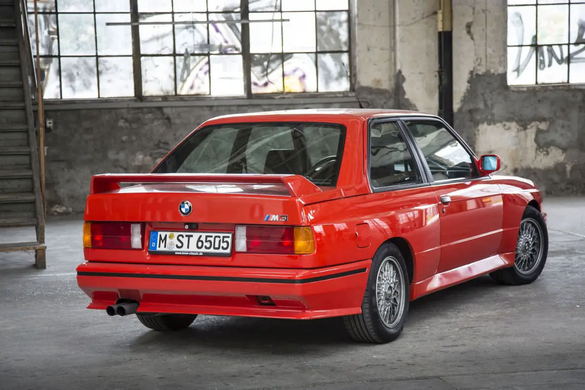 <p>The E30 M3 was built for homologation purposes to compete in the Deutsche Tourenwagen Meisterschaft (DTM) racing series. Its boxy design and high-revving engine made it an instant classic. The car’s fender flares and aerodynamic body kit were designed to accommodate wider wheels and tires for improved handling.</p> ::BMW USA