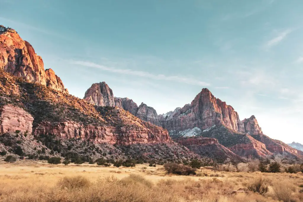 <p>Zion is known for its red rock landscapes and clear blue skies. The park has three main campgrounds with basic facilities like restrooms, picnic areas, and water access. The South and Watchman campgrounds can accommodate both tents and RVs, and there are group sites as well. Zion’s well-marked trails, including the famous Angels Landing and The Narrows, offer options for both easy walks and challenging hikes.</p> ::Unsplash